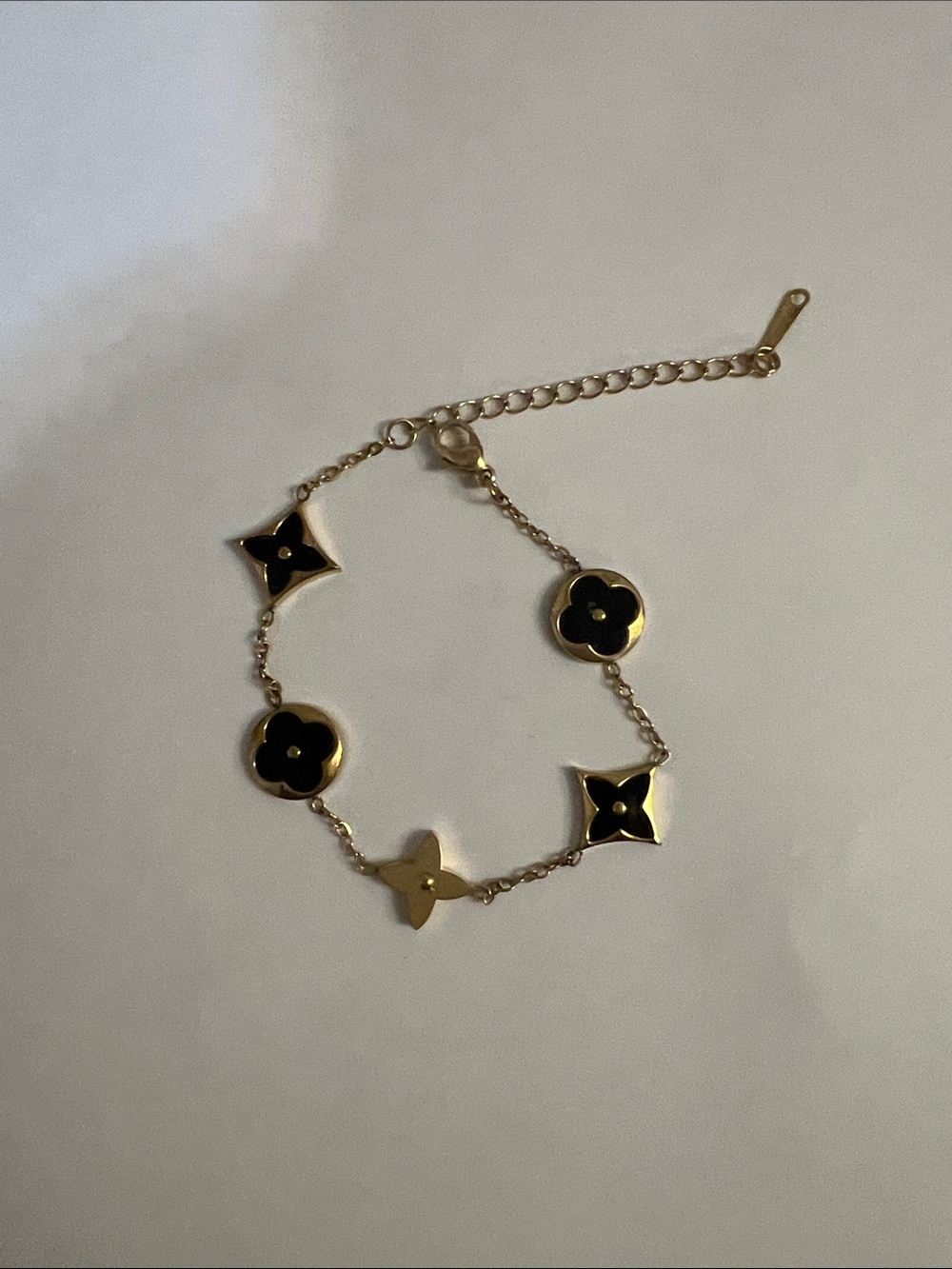 Inspired Gold Bracelet with Black Flower Motifs